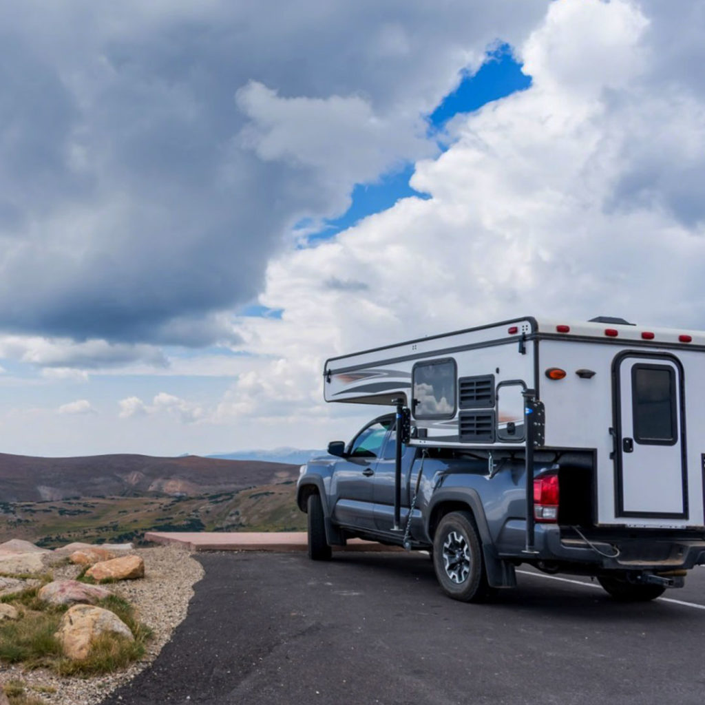 Truck with camper on roadtrip