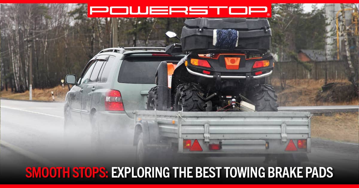 a truck tows a trailer down a road | PowerStop