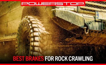 a vehicle kicks up dust while rock crawling | PowerStop